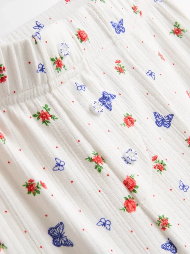 Pantalones de pijama acanalados con estampado de mariposas