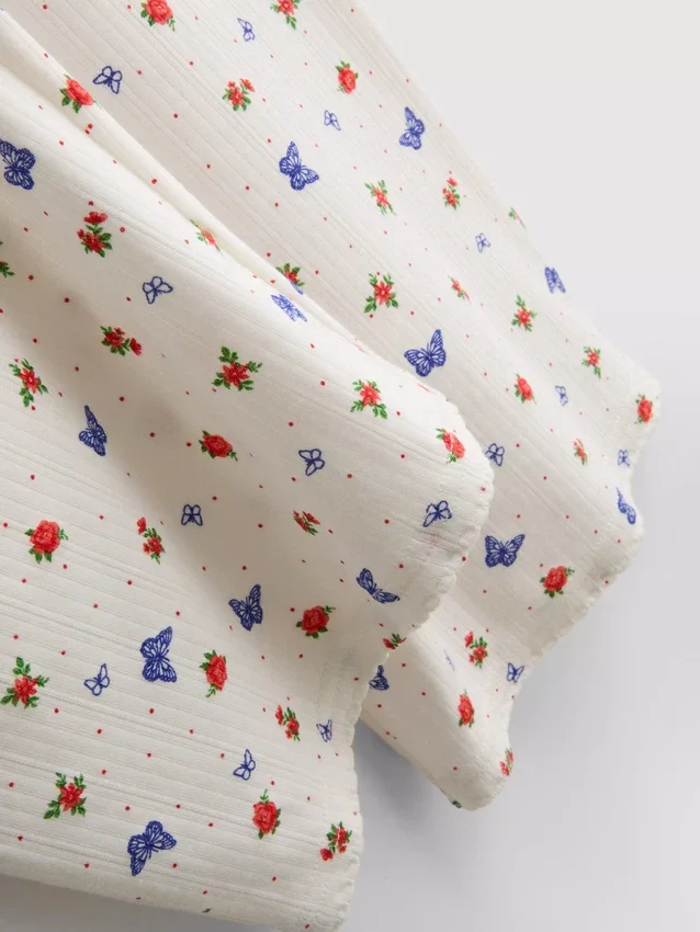 Pantalones de pijama acanalados con estampado de mariposas