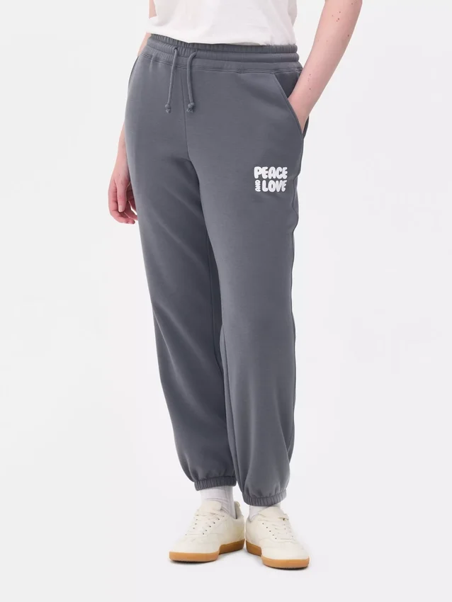 Pantalones de sudadera estampados con dobladillo