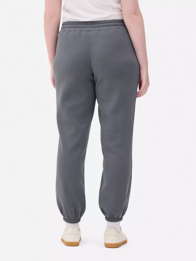Pantalones de sudadera estampados con dobladillo
