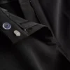 Pantalones elásticos con pliegues y talle medio