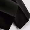 Pantalones elásticos con pliegues y talle medio