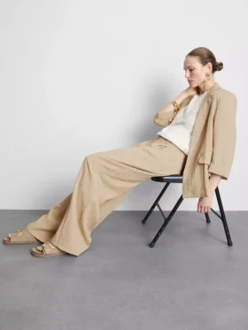 Pantalones holgados con textura y talle medio