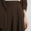 Pantalones holgados con textura y talle medio