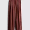 Pantalones holgados con textura y talle medio