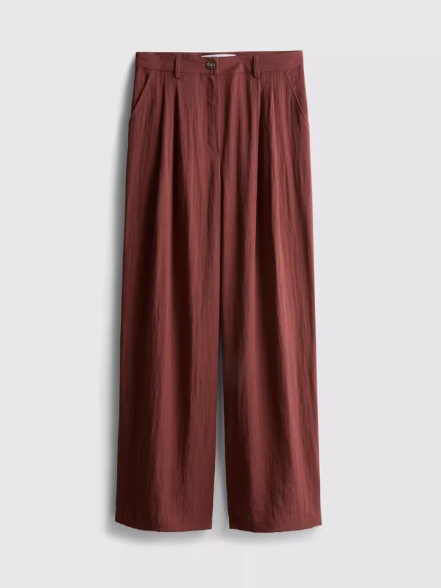 Pantalones holgados con textura y talle medio