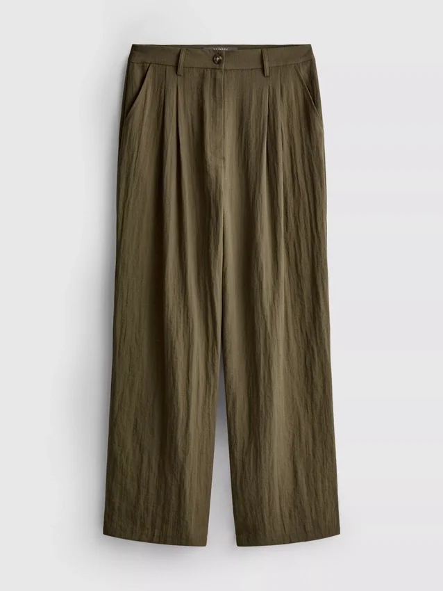 Pantalones holgados con textura y talle medio