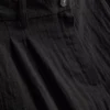 Pantalones holgados con textura y talle medio