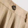 Pantalones holgados con textura y talle medio