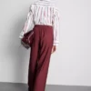 Pantalones palazzo con detalle de moño