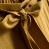 Pantalones palazzo con detalle de moño