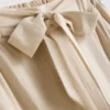 Pantalones palazzo con detalle de moño