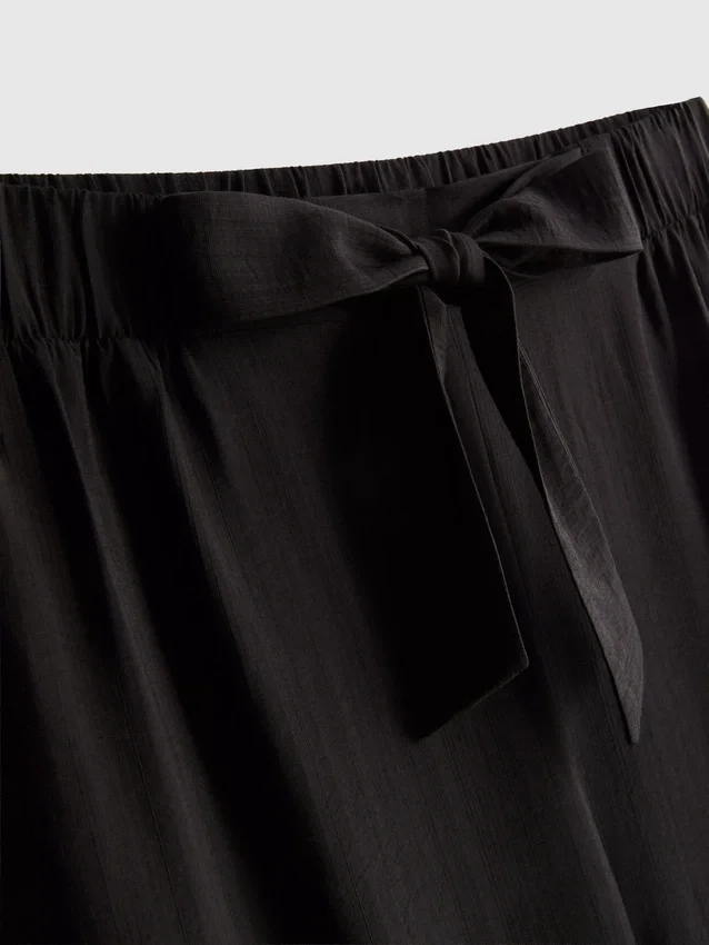 Pantalones palazzo con detalle de moño