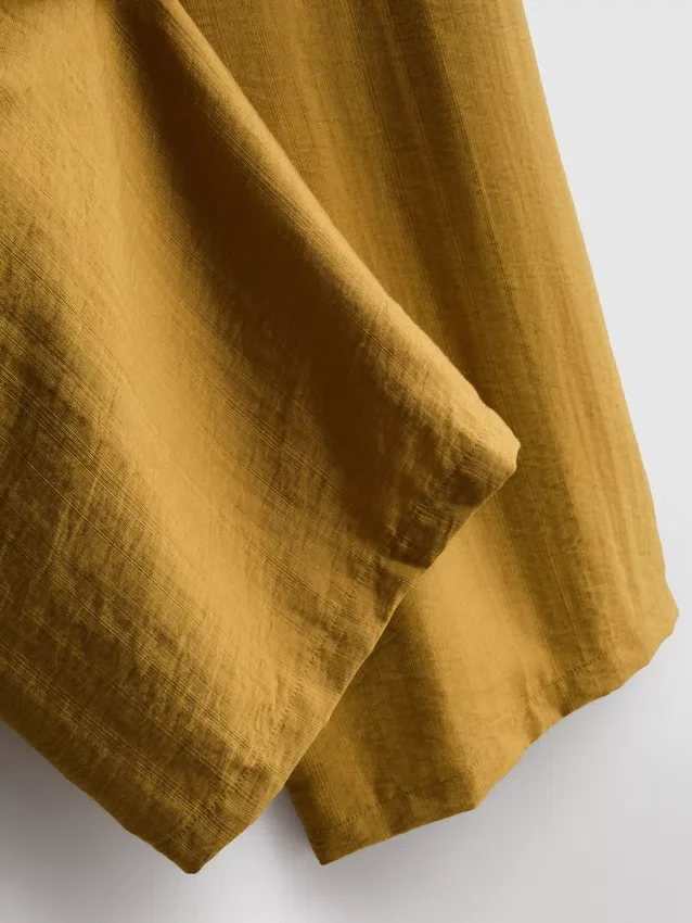 Pantalones palazzo con detalle de moño