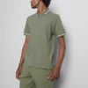 Polo con cuello con cremallera y textura