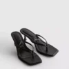 Sandalias tipo mule con talón y tiras entre los dedos