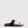 Sandalias tipo mules con barra en T y hebilla