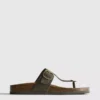 Sandalias tipo mules con barra en T y hebilla