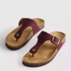 Sandalias tipo mules con barra en T y hebilla