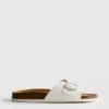 Sandalias tipo mules con correa y hebilla