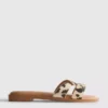 Sandalias tipo mules con tiras cruzadas