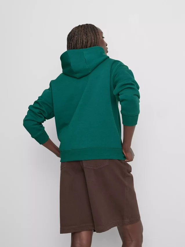 Sudadera con capucha de estilo deportivo y holgado
