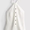 Top con cuello halter y botones, de textura