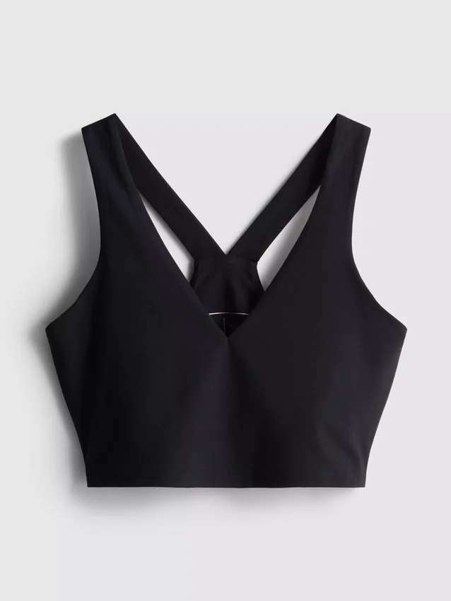 Top corto deportivo con soporte suave y cuello en V