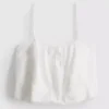 Top corto tipo camisola de algodón bordado