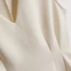 Top sin mangas con peplum y cuello en V