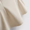 Top sin mangas con peplum y cuello en V