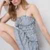 Top tipo camisola con peplum de cuadros vichy fruncido