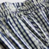 Top tipo camisola con peplum de cuadros vichy fruncido