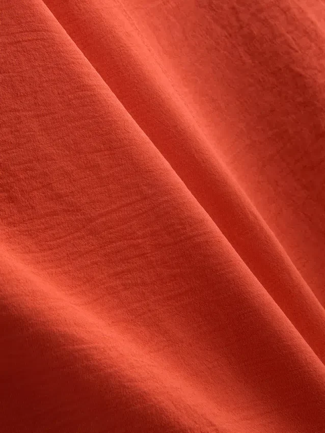 Top tipo camisola con textura y ventilación