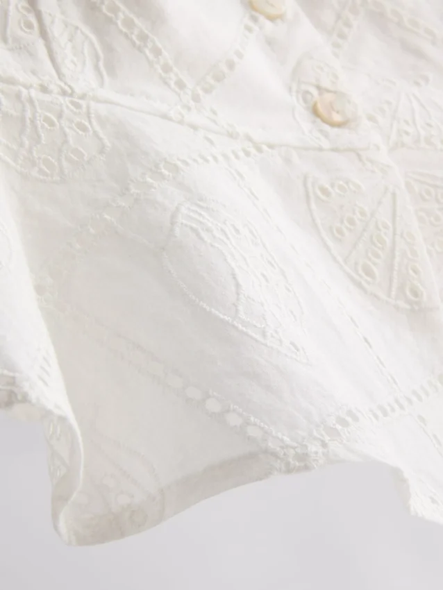 Top tipo camisola corto de algodón con calados