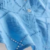 Top tipo camisola corto de algodón con calados