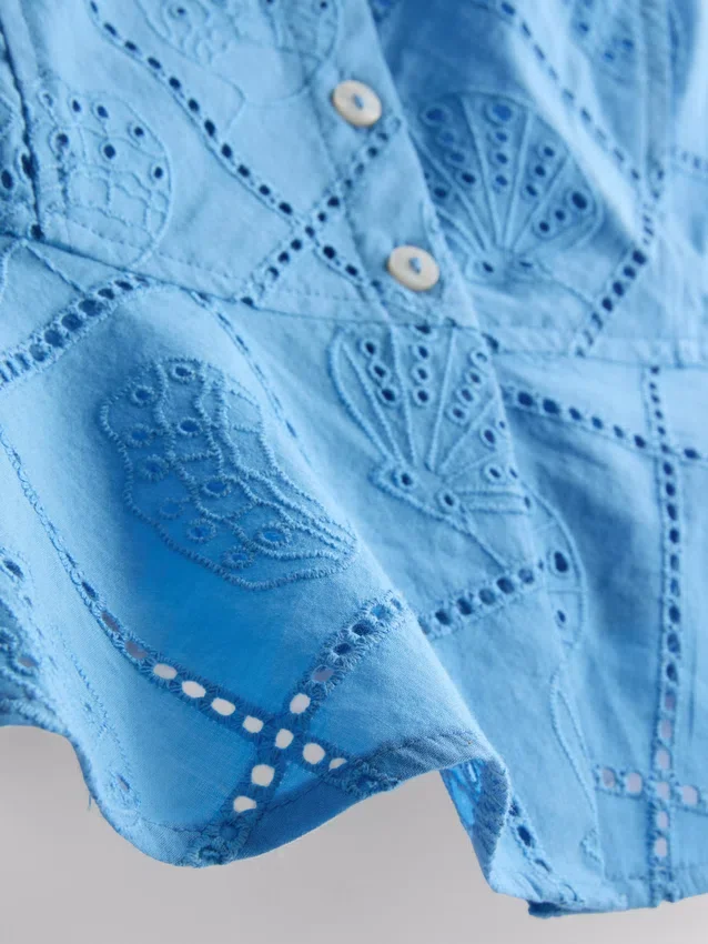 Top tipo camisola corto de algodón con calados