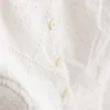 Top tipo camisola corto de algodón con calados