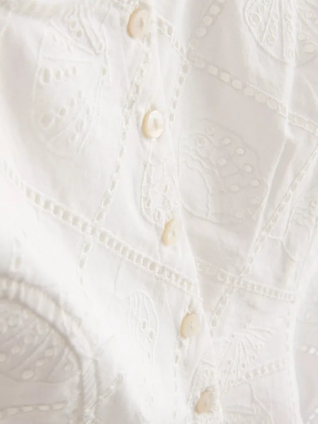 Top tipo camisola corto de algodón con calados