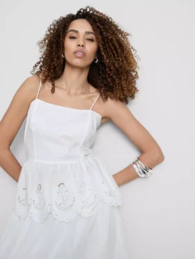 Top tipo camisola de algodón con bordado y dobladillo con volantes