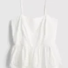 Top tipo camisola de algodón con bordado y dobladillo con volantes