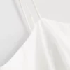 Top tipo camisola de algodón con bordado y dobladillo con volantes