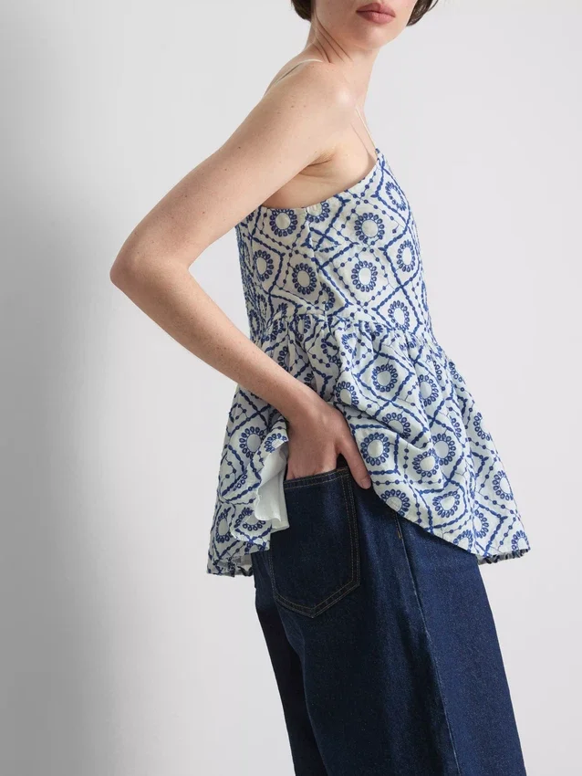 Top tipo camisola de algodón con calados