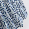 Top tipo camisola de algodón con calados
