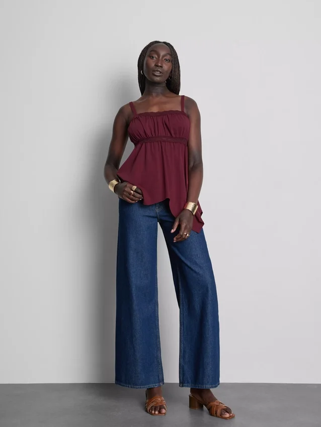 Top tipo camisola de algodón con dobladillo en forma de pañuelo