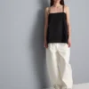 Top tipo camisola de algodón con dobladillo en forma de pañuelo