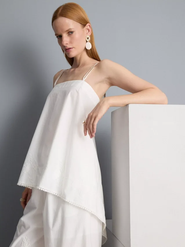 Top tipo camisola de algodón con dobladillo en forma de pañuelo