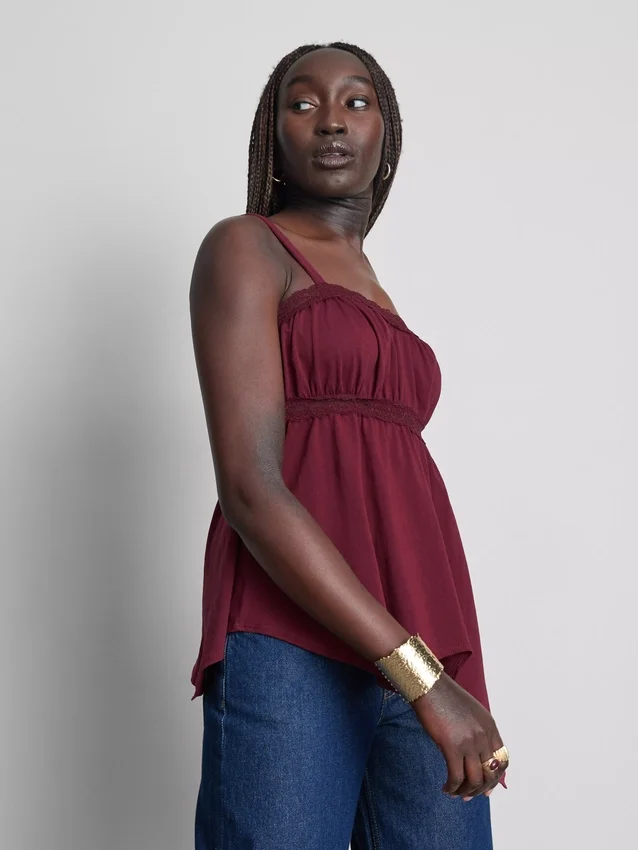 Top tipo camisola de algodón con dobladillo en forma de pañuelo