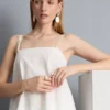 Top tipo camisola de algodón con dobladillo en forma de pañuelo