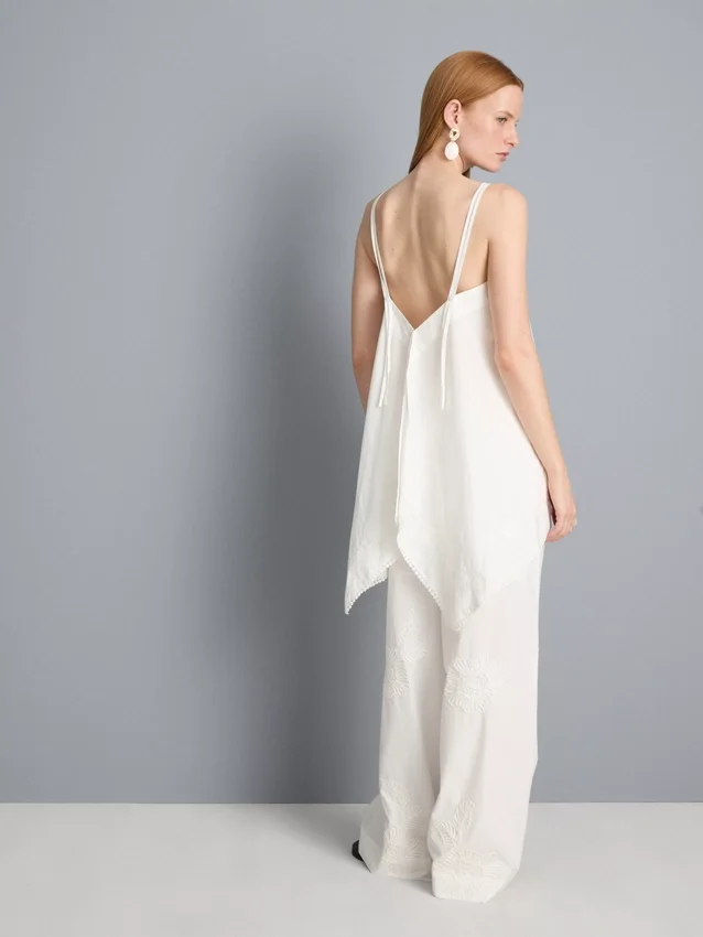 Top tipo camisola de algodón con dobladillo en forma de pañuelo